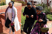Jackie Phamotse, Simphiwe Majola and Basetsasna Kumalo arrive at the Randburg magistrate's court. 