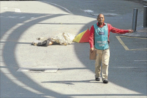 CRIME SCENE: A Builders Warehouse customer was killed when two Zim nationals tried to rob the store yesterday.