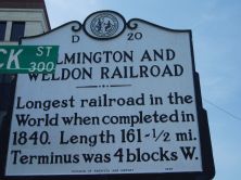 Longest railroad in the world when completed in 1840. Length 161 1/2 mi. Terminus was 4 blocks W.Plaque via North Carolina Highway Historical Marker Program, and is used with their permission....