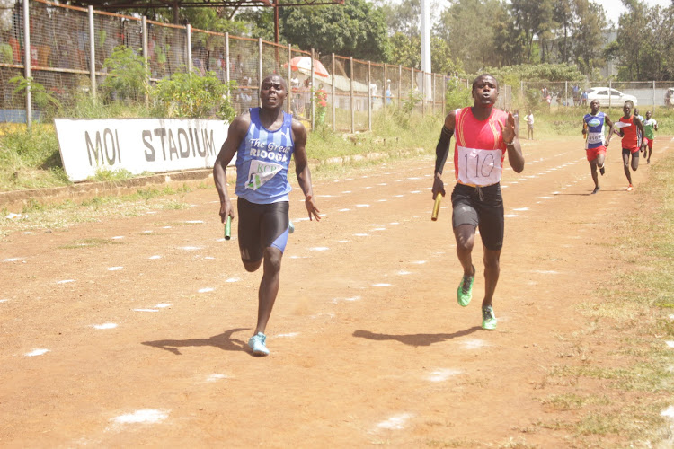 Daniel Wasike (L) of Riooga secondary and Simeon Araka of Keberesi battle it out during the Nyanza secondary schools championships at Moi Stadium in Kisumu