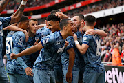 Ollie Watkins (centre) celebrates scoring Aston Villa's second goal with teammates in the Premier League match against Arsenal at Emirates Stadium in London on Sunday.