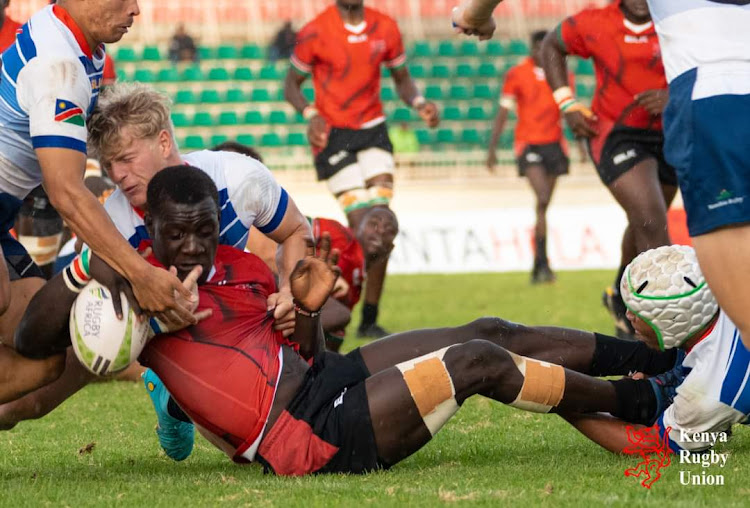 Kenya's Jacktone Omondi scoring a try in a past match against Namibia