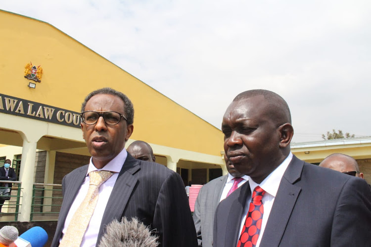 Turkish businessman Harun Aydin's lawyer Ahmednasir Abdullahi and Kapseret MP Oscar Sudi address journalists at Kahawa law courts, Kamiti, on August 9, 2021