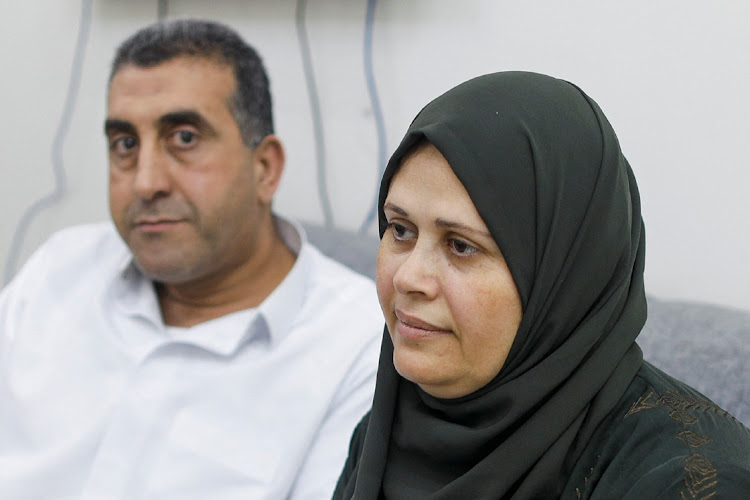Najwa Abu Hamada, whose embryos were stored at Al Basma IVF Centre, Gaza's largest fertility clinic that was struck by an Israeli shell during the ongoing conflict between Israel and Hamas, sits next to her husband during an interview with Reuters in Doha, Qatar, March 25 2024. Picture: REUTERS/Saleh Salem