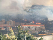 Fire fighters tried to prevent a fire from spreading to the University of Cape Town on Sunday after it gutted part of the Rhodes Memorial restaurant.