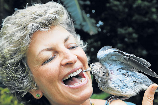 WORLDWIDE FANS: Fine art photographer Marlene Neumann has a profound relationship with a dove called Sophie, who has become a social media sensation. Picture: SUPPLIED