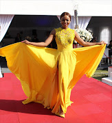 Bonang Matheba steals the show in a beautiful canary yellow Gert-Johan Coetzee gown. Picture credit: Anesh Debiky/Gallo Images