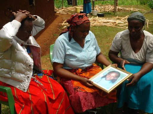 Linet Keseri (centre) and relatives mourn the death of her daughter who died after an outing with a teacher, November 9, 2016. /JOSEPH JAMENYA