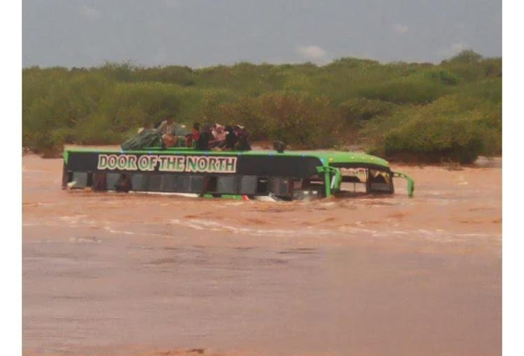 A bus that has been marooned by raging waters at Arer near Tulla village, Tana River County