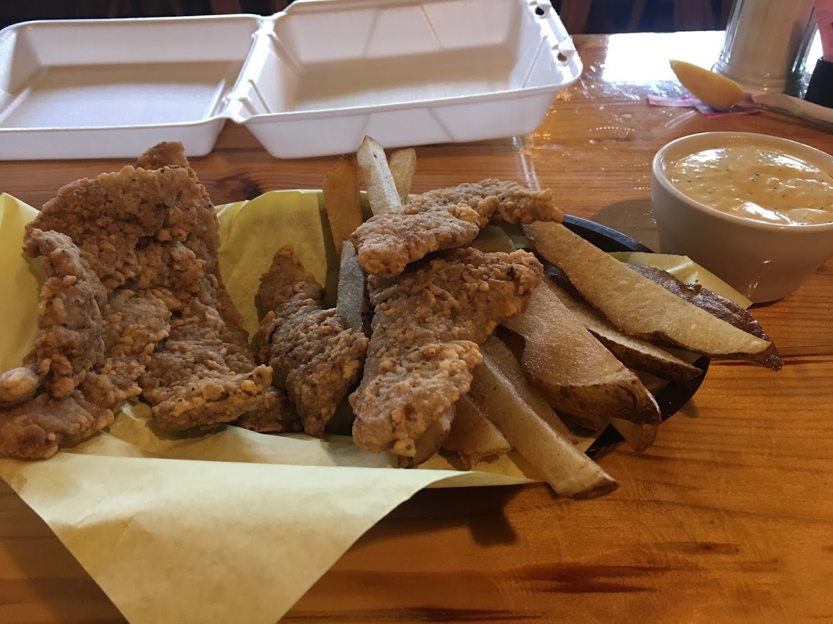 Gluten free chicken fried steak strips, fries and the best gluten free cream gravy. I get 2 meals out of this...see the to go box waiting. highly suggest adding an order gf fried zucchini/squash.