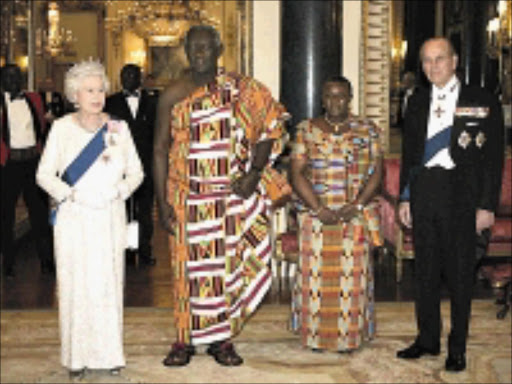GRAND WELCOME: Britain's Queen Elizabeth II and husband Prince Phillip flank the then -president of Ghana John Agyekum Kufuor and his wife Theresa at a state banquet at Buckingham Palace in London. 13/03/2007. Pic. Lefteris Pitarakis. © Getty Images.