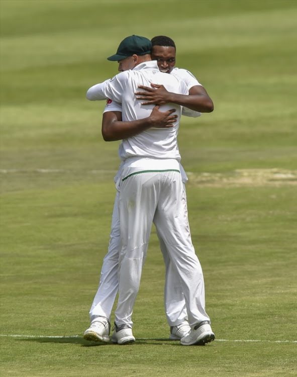 Aiden Markram and Lungi Ngidi of South Africa celebrate after Ngidi got the wicket of Virat Kohli(c) of India(unseen) during day 1 of the 3rd Sunfoil Test match between South Africa and India at Bidvest Wanderers Stadium on January 24, 2018 in Johannesburg.