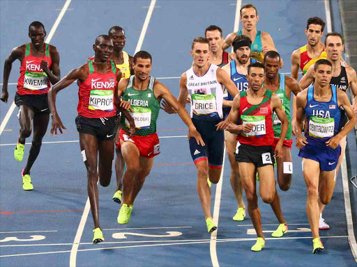 Asbel Kiprop (KEN) of Kenya tries to get around Taoufik Makhloufi (ALG) of Algeria REUTERS/David Gray