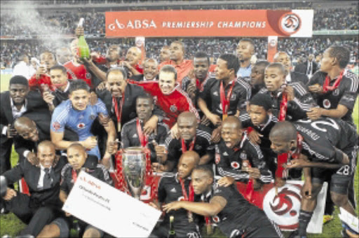 WINNING COMBINATION : Orlando Pirates players and officials celebrate after winning the Premiership at the weekend. Photo: Gallo Images