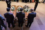 Caskets of Jane Govindsamy and her daughters Denisha and Rackelle at the Faith Revival Centre in Durban.