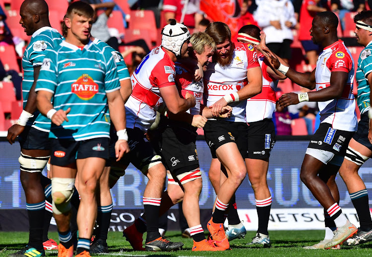 Marnus Schoeman of the Xerox Lions celebrates his try with teammate during the Currie Cup semi final match against the Tafel Lager Griquas at Emirates Airline Park in Johannesburg on August 31, 2019.
