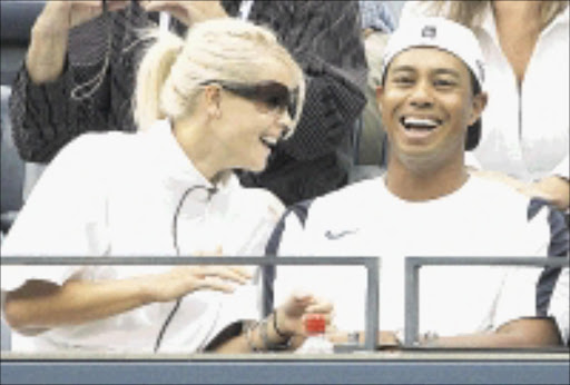 ** FILE ** In this Sunday, Sept. 10, 2006 file photo, Tiger Woods and his wife Elin Nordegren attend the US Open tennis tournament in New York. Woods announced on his Web site early Monday, Feb. 9, 2009 that his wife, Elin, had given birth to a boy, Charlie Axel Woods. It is the couple's second child following the birth of daughter Sam Alexis in June 2007. (AP Photo/Richard Drew)