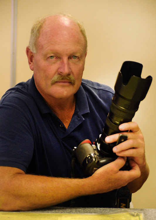 Mike Holmes has seen it all in his illustrious career as a press photographer