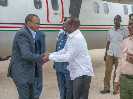 Deputy President William Ruto receives President Uhuru Kenyatta on arrival at Mandera airstrip at the start of a 3-day working tour of Northern Kenya on Thursday Photo/DPPS