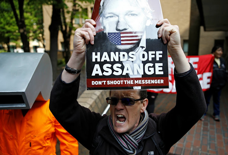 People protest outside Southwark Crown Court where WikiLeaks founder Julian Assange will be sentenced, in London, Britain, May 1, 2019.
