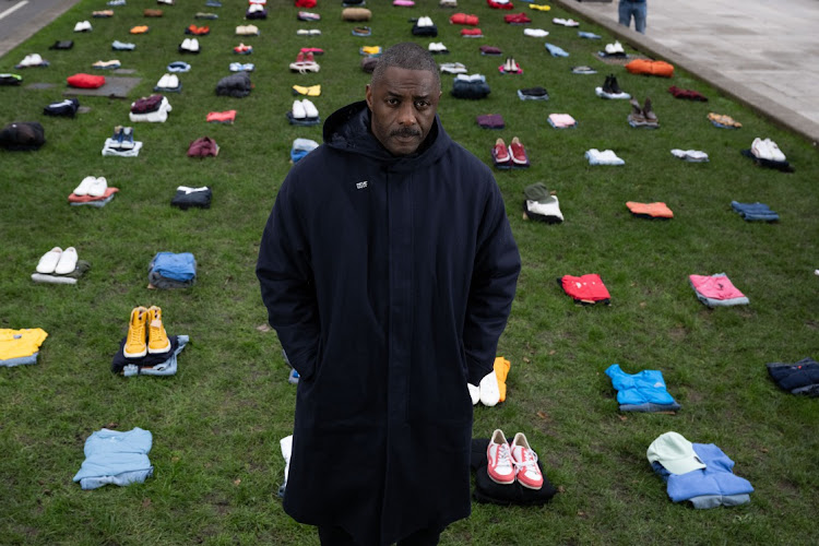 Idris Elba stands in front of an installation of over 200 bundles of clothing representing the lives lost to Knife crime in the UK as he calls on the Government to take immediate action to prevent serious youth violence at Parliament Square on January 08, 2024 in London, England.