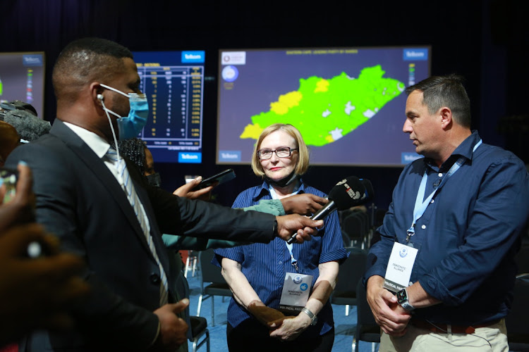 The DA's federal council chair, Helen Zille, stands next to DA leader John Steenhuisen as he answers questions from the media at the IEC results centre in Pretoria. File photo.
