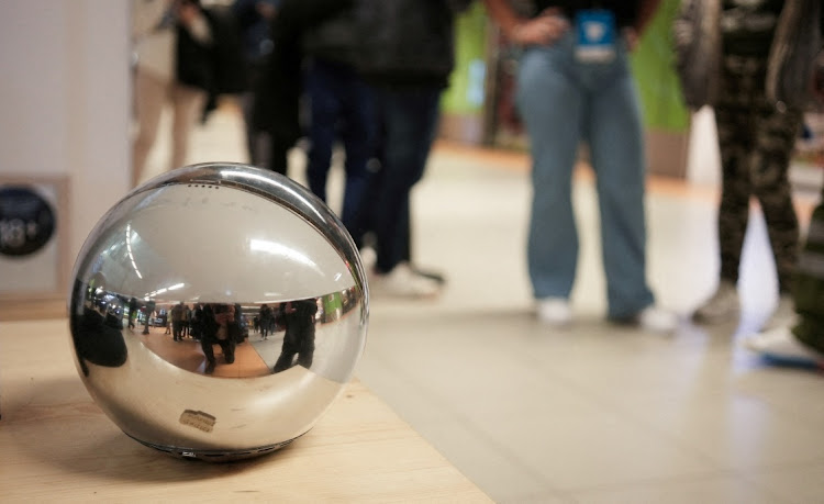 People queue to use WorldCoin's iris scanners in Madrid, Spain, March 6 2024. Picture: REUTERS/ANTOINE DEMAISON