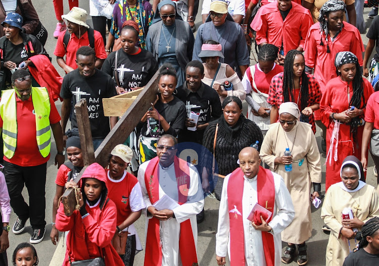 A procession of Catholic Faithfuls observing the way of the cross marked on Good Friday to remember the crucifixion of Jesus on March 29, 2024.
