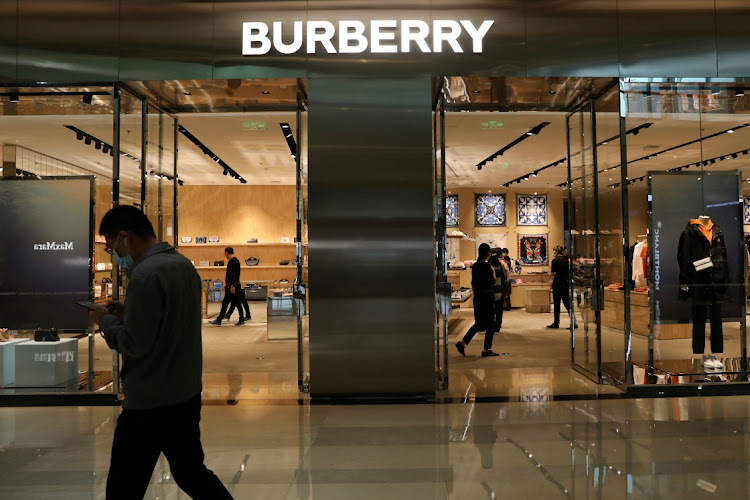 A man walks past a store of luxury brand Burberry at a shopping mall in Beijing, China. Picture: REUTERS/TINGSHU WANG