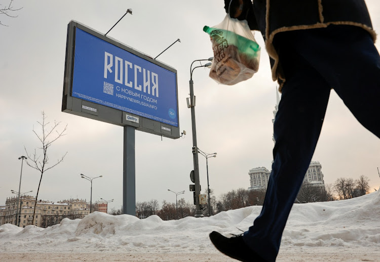 A billboard shows the word ‘Russia’, the message ‘Happy New Year’ and a QR code that is a gateway to a website of jailed Kremlin critic Alexei Navalny's supporters, in Moscow, Russia, December 7 2023. Picture: STRINGER/REUTERS