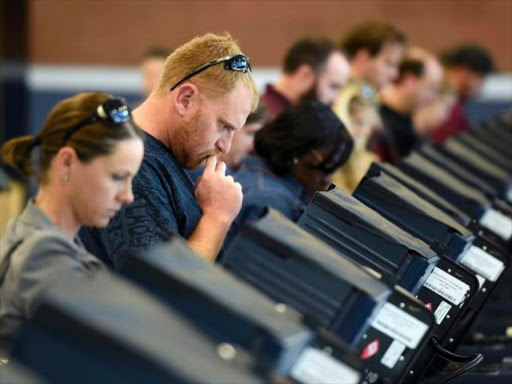 Voters cast their ballots during voting in the 2016 presidential election in Las Vegas, Nevada, US November 8, 2016. /REUTERS