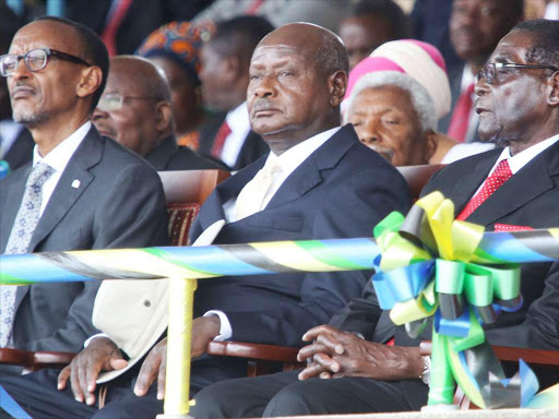 THE OLD GUARD: Presidents Paul Kagame (Rwanda), Yoweri Museveni (Uganda). ‘As the leaders of Rwanda, Burundi and South Sudan faced growing dissent at home, they too embraced the alliance of the leaders, which in effect turned the East African Commu-nity and IGAD into a club of dictators.’