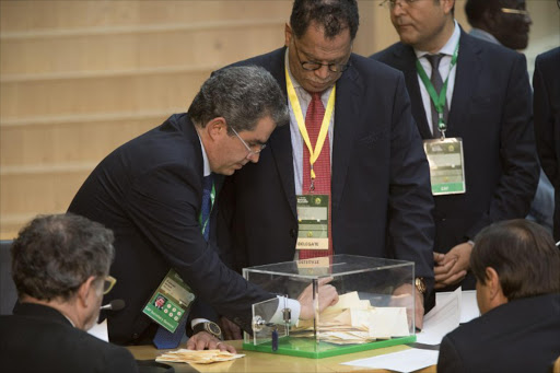 Delegates of the Confederation of African Football (CAF) count ballots during the vote for the organisation's new president in Addis Ababa on 16 March 2017.