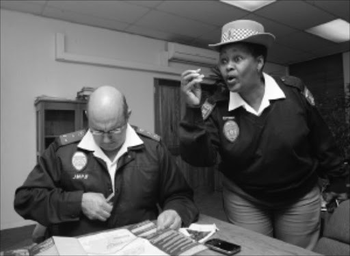 20100708VNH. ALL SYSTEMS GO: JMPD Director of operations Gerrrie Gerneke and JMPD Spokesperson Edna Mamonyane during a press briefing at the offices in Faraday.Pic:VELI NHLAPO. 08/08/2010. © SOWETAN