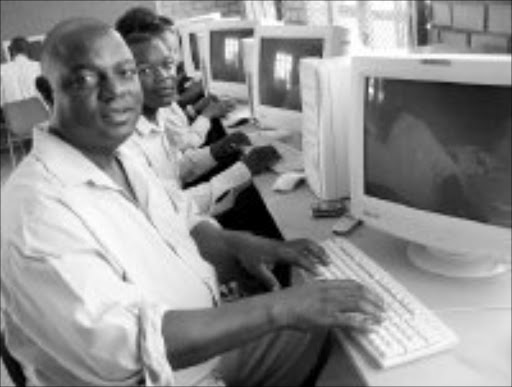 NEW HORIZONS: Steve Sefofa and fellow pupils at Masopha High prepare to work on computers for the first time. Eskom gave 20 computers to the school. Pic. Alex Matlala. © Sowetan.