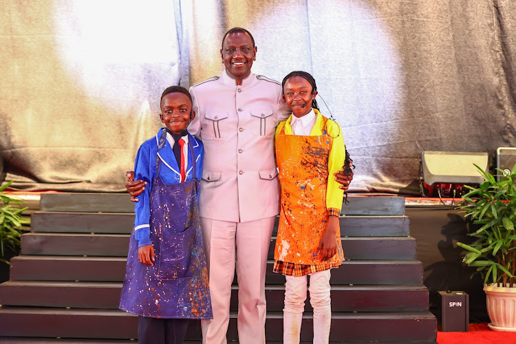 President William Ruto poses for a photo with pupils at the National Drama and Film Festival winners' State concert at the Sagana State Lodge, Nyeri County on April 18, 2024.