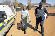 MURDER SUSPECT: Bertha Maretlwa outside the Coligny Magistrate's Court. The North West mother is accused of killing her  husband and daughter. PHOTO: VELI NHLAPO