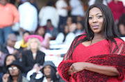 In classy red: Rami Chuene from 'The Queen' at The Vodacom Durban July.