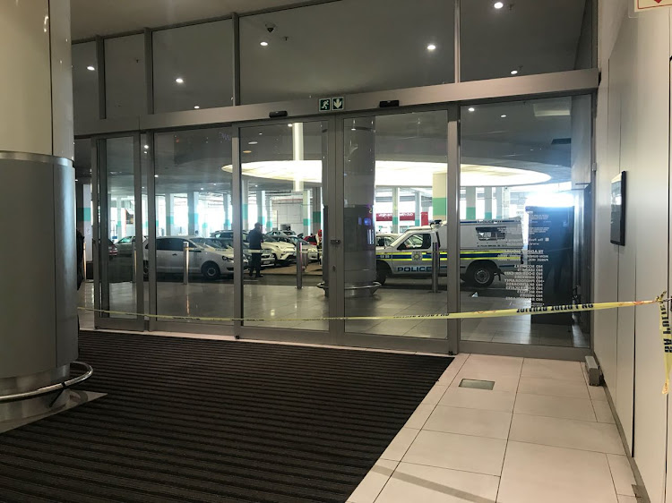 Police and bomb technicians have cordoned off a parking area at the Pavilion shopping centre after a “device” was spotted in a corner of the lot.