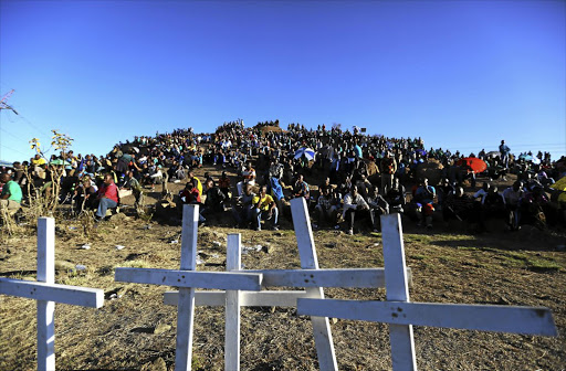 Miners gather on a koppie near Marikana mine near Rustenburg in North West to commemorate the killing of 44 people there in August 2012.