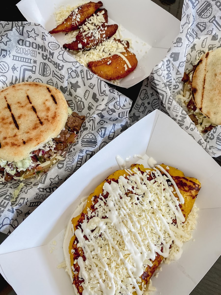 Cheese cachapa (sweet corn arepa), meat lovers arepa and sweet plantains. SO GOOD