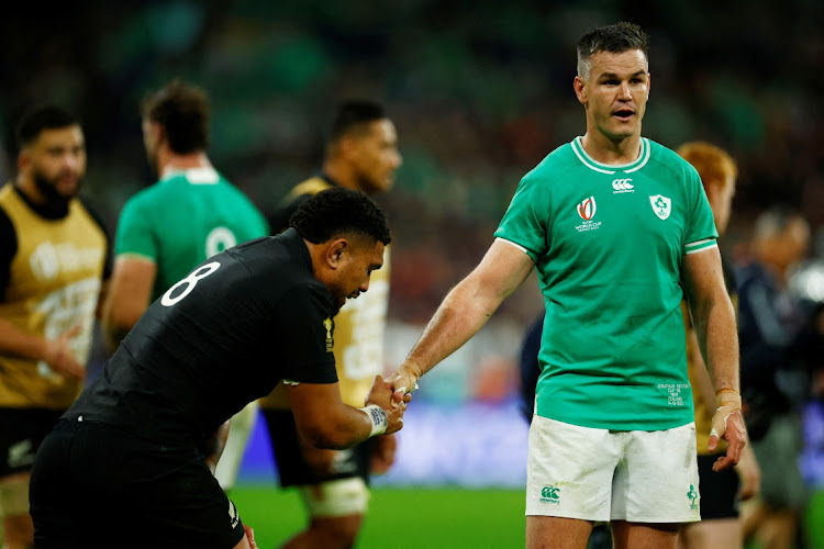 Rugby Union - Rugby World Cup 2023 - Quarter Final - Ireland v New Zealand - New Zealand's Ardie Savea, left, shakes hands with Ireland's Johnny Sexton after their Rugby World Cup 2023 match at Stade de France in Saint-Denis, France, in this October 14 2023 file photo. Picture: SARAH MEYSSONNIER/REUTERS