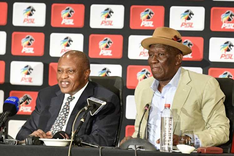 Premier Soccer League (PSL) chairman Irvin Khoza and Police Minister Bheki Cele speak to the media during the PSL and the SA Police Service (SAPS) parnership announcement at the Convention Centre at Emperors Palace, east of Johannesburg on September 06, 2018.