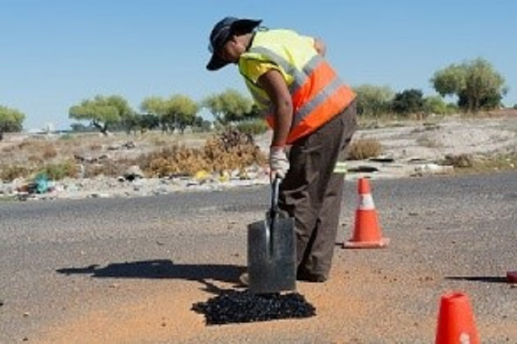 A City of Cape Town worker repairs a pothole. Image: City of Cape Town