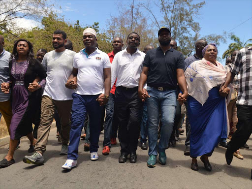 Mombasa Governor Hassan Joho arrives at the Mombasa DCI accompanied by Opposition leaders and supporters, March 29, 2017. /JOHN CHESOLI