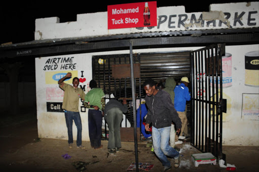 FILE PHOTO: Violence erupted across Sebokeng into the early hours of Tuesday after a Pakistani male killed a street vendor Josiah Ngwenya in Evaton. Young people looted foreign owned shops in Sebokeng in retaliation to the murder. Photo Thulani Mbele