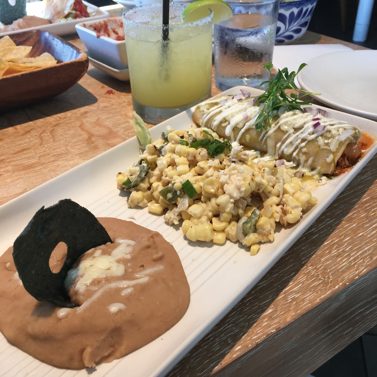 Chicken enchilada with street corn and refried beans and a cucumber margarita with Don Julio subbed. So good.