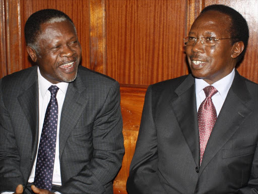 Former Energy minister Chris Okemo and former Kenya Power MD Samuel Gichuru at the High Court on August 4, 2011 /FILE