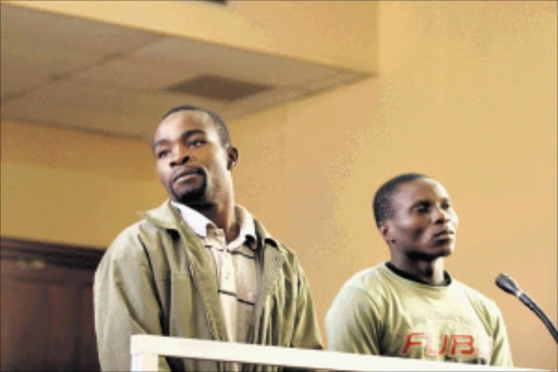 UNDER THE SPOTLIGHT: Accused Gerald Nyantumbo, 28, and Nelson Maphosa, 25, in the dock in the Johannesburg magistrate's court yesterday. Pic.: BAFANA MAHLANGU. 12/05/2010. © Sowetan