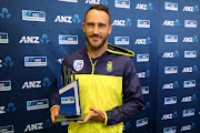 South Africa's captain Faf du Plessis holds the trophy after the day five of the third Test cricket match between New Zealand and South Africa was called off due to rain at Seddon Park in Hamilton on March 29, 2017. The final day of the deciding third Test between New Zealand and South Africa was abandoned because of persistent rain in Hamilton on MArch 29, giving the Proteas a 1-0 series victory.